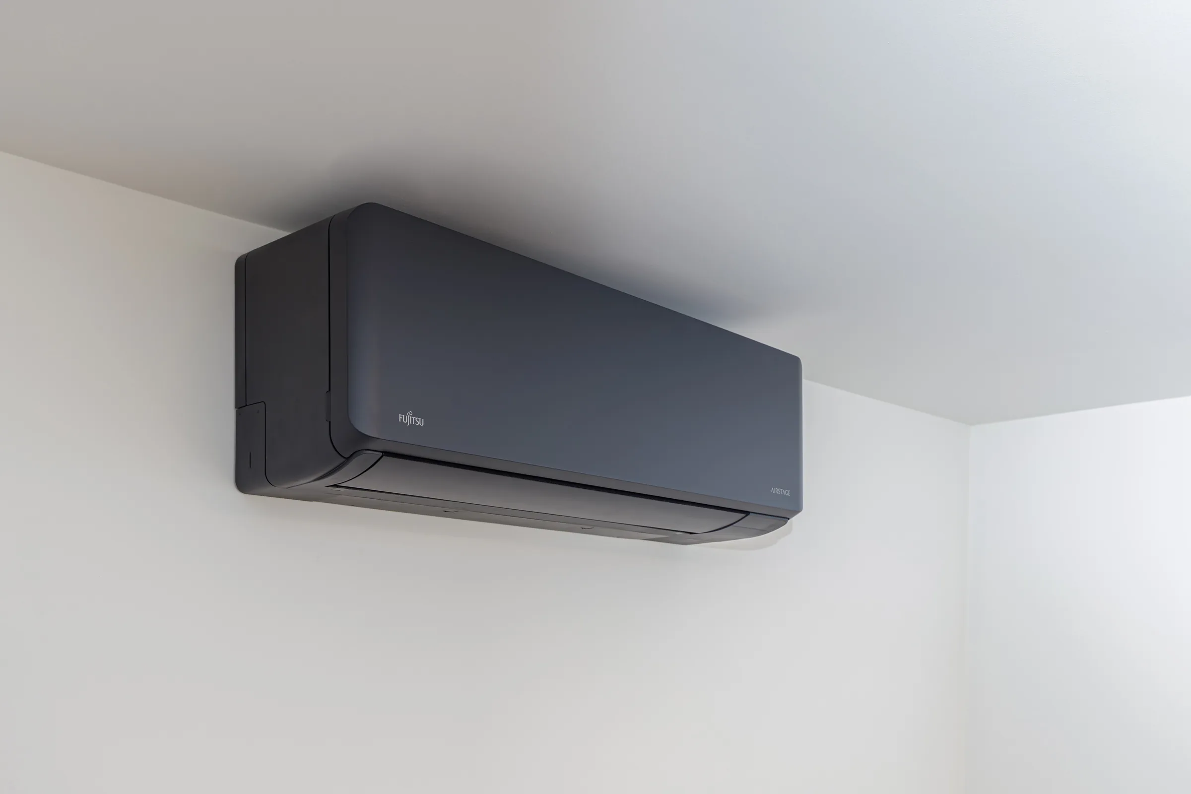 Close view of a wall-mounted air-conditioning unit inside a garden room